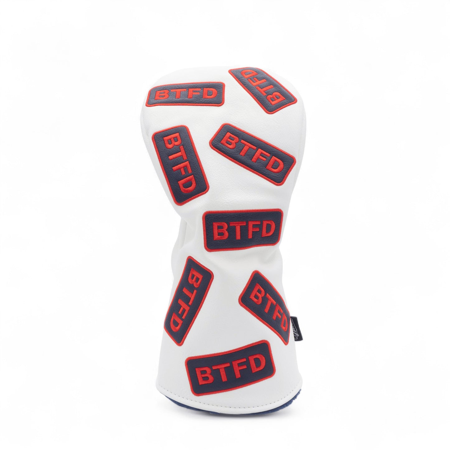 Golf driver cover with navy and red embroidered 'BTFD' patches on white background