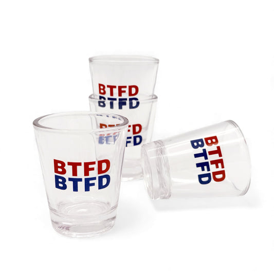 Set of 4 clear shot glasses with 'BTFD' text in red and blue on a white background