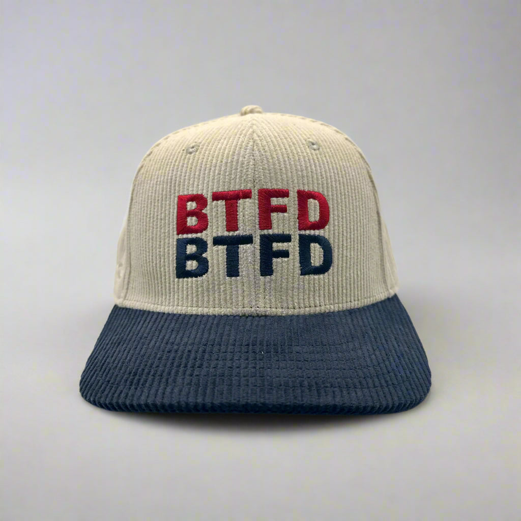 Corduroy cap with 'BTFD' text on a white background