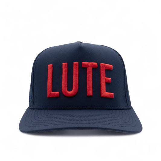 Navy blue cap with red 'LUTE' text on a white background