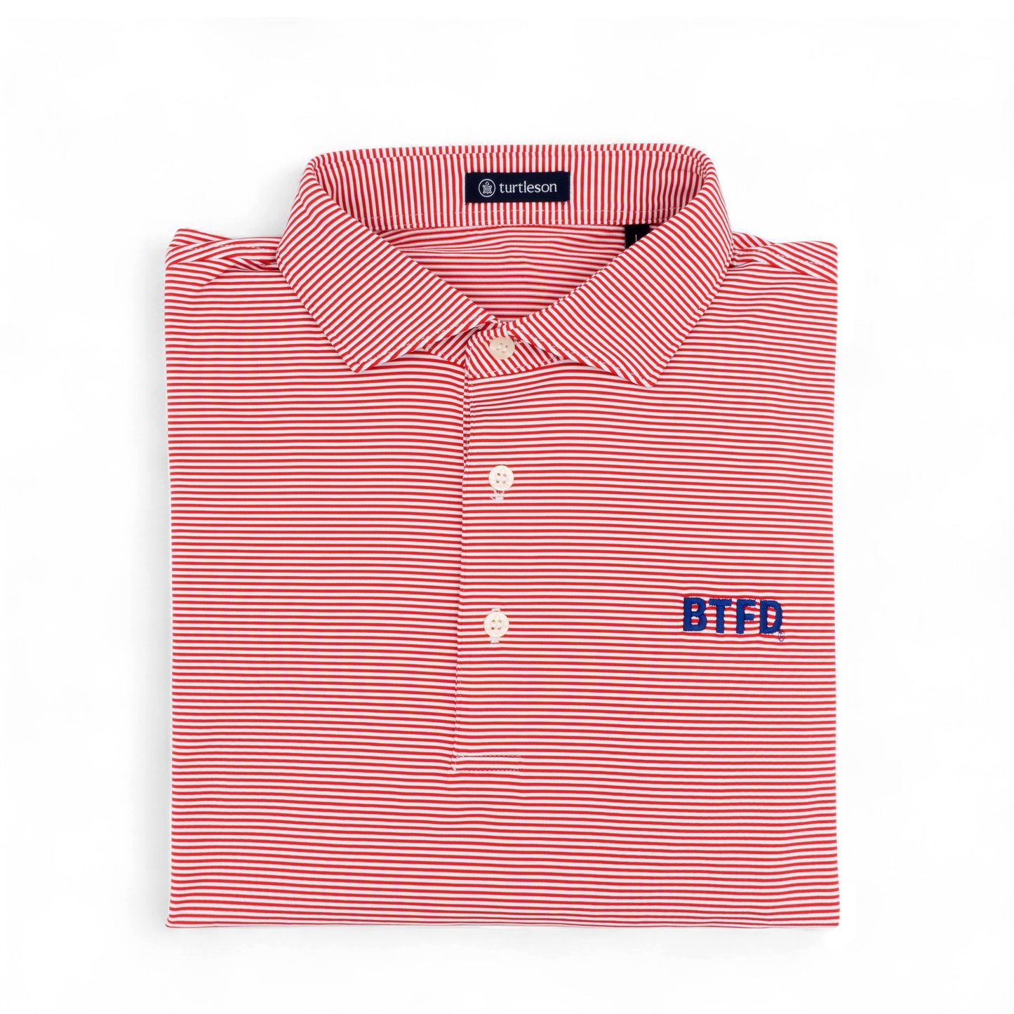Folded red and white striped golf shirt with 'BTFD' embroidery on a white background