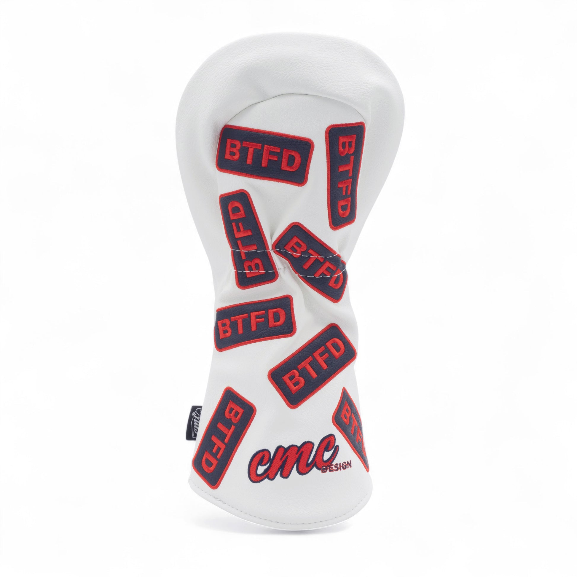 Golf driver cover with navy and red embroidered 'BTFD' patches on white background