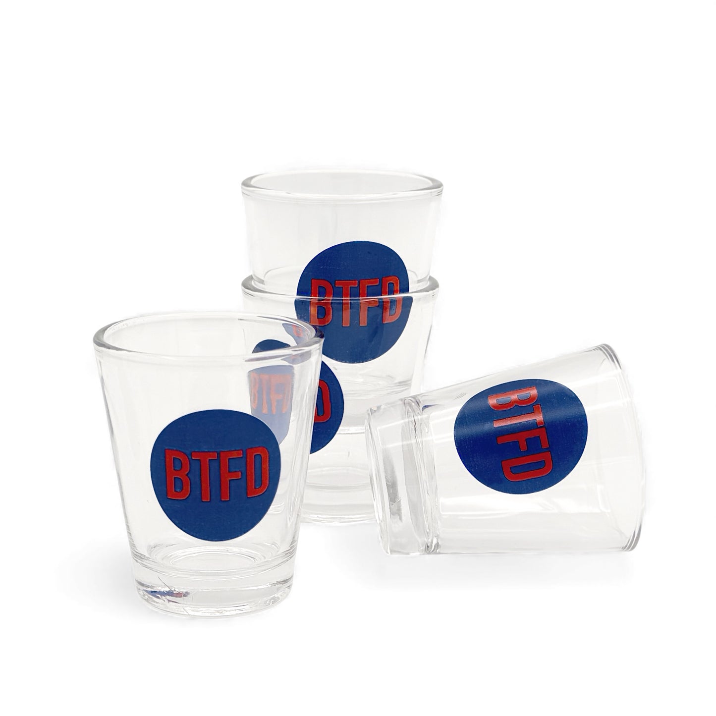 Set of 4 shot  glasses with blue circle and red 'BTFD' on a white background