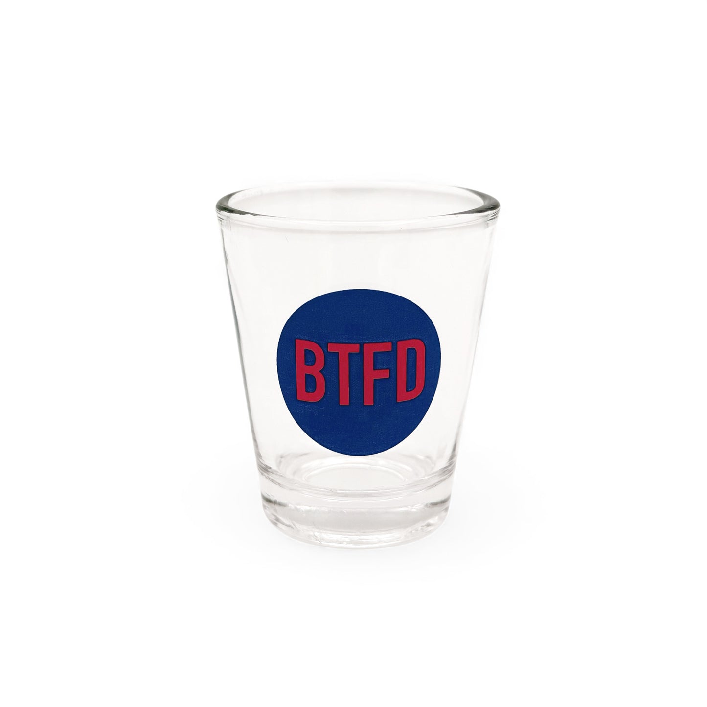 Clear shot glass with a blue circle and red text 'BTFD' on a white background