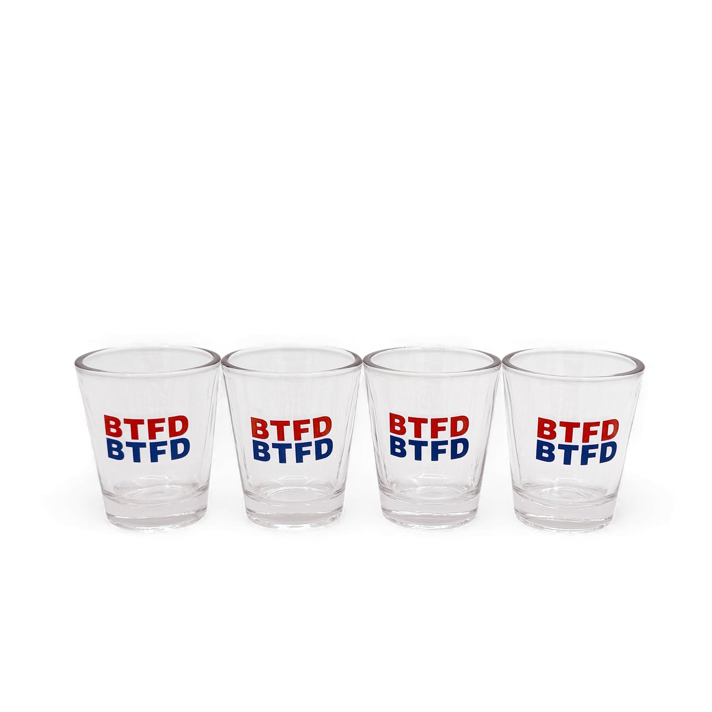 Four clear shot glasses with 'BTFD' text in red and blue on a white background