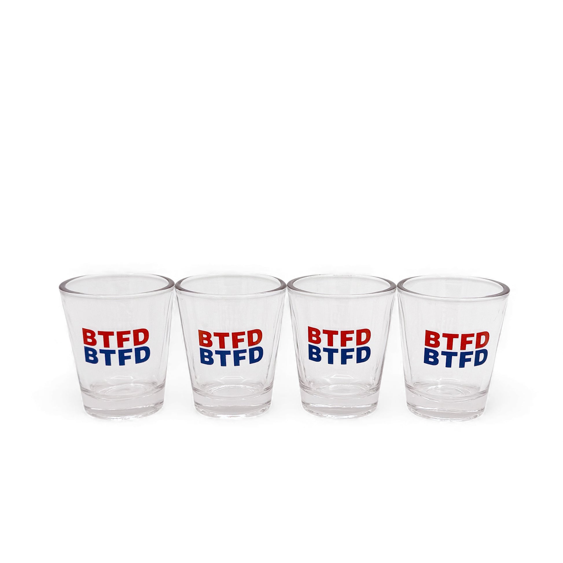 Four clear shot glasses with 'BTFD' text in red and blue on a white background