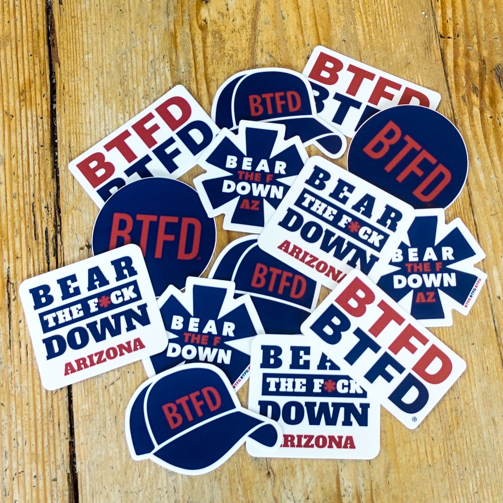 BTFD stickers on a wood table