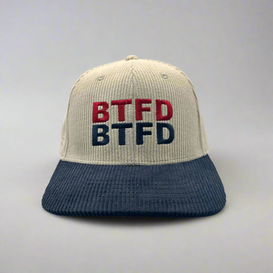 Corduroy cap with 'BTFD' text on a white background