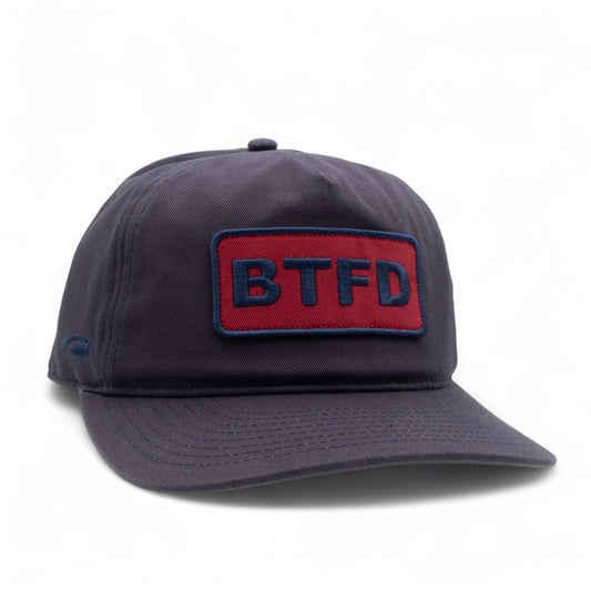 Navy cotton twill cap with a red and blue 'BTFD' embroidered patch on a white background