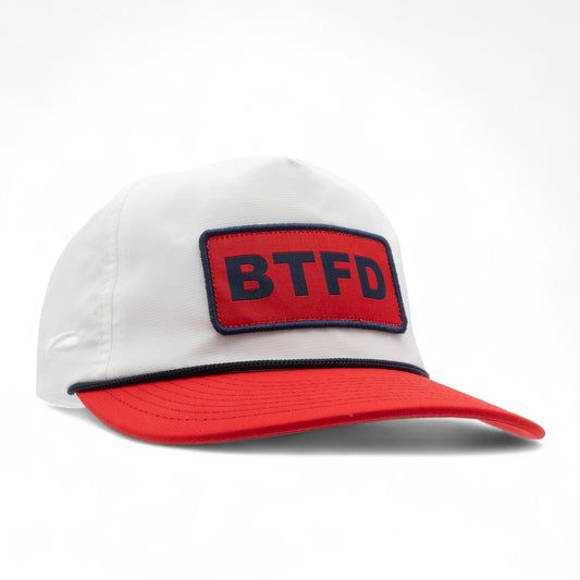 White cap with a red bill and 'BTFD' patch on a white background
